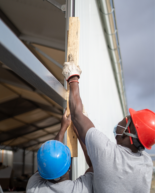 Workers installing a signage structure